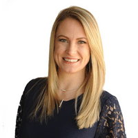 Carolyn Mayberry Arvold, mortgage team member, smiling with blonde hair and a dark lace top, promoting mortgage services and rate alert notifications.