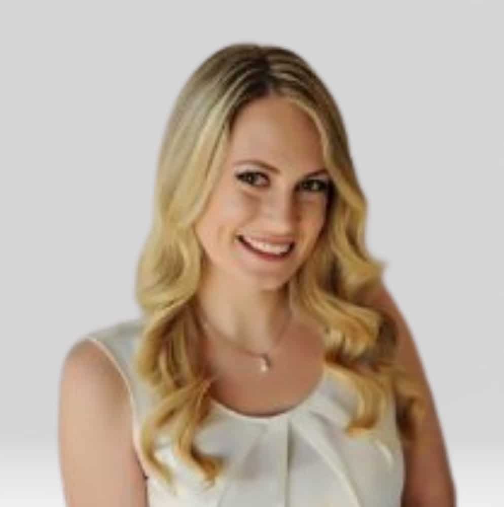 Carolyn Mayberry, Mortgage Loan Originator at Refined Lending, smiling with light blonde hair and a white blouse, professional portrait.